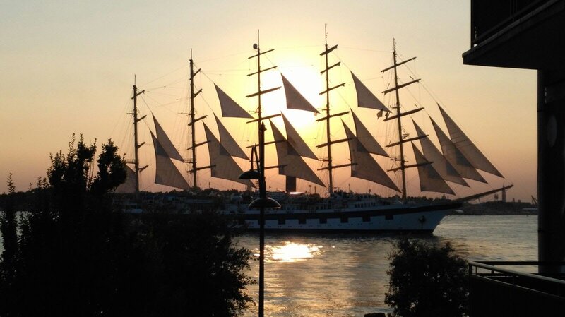 Sailing Ship at Sunset — Orange, Serene, Photograph, Trees