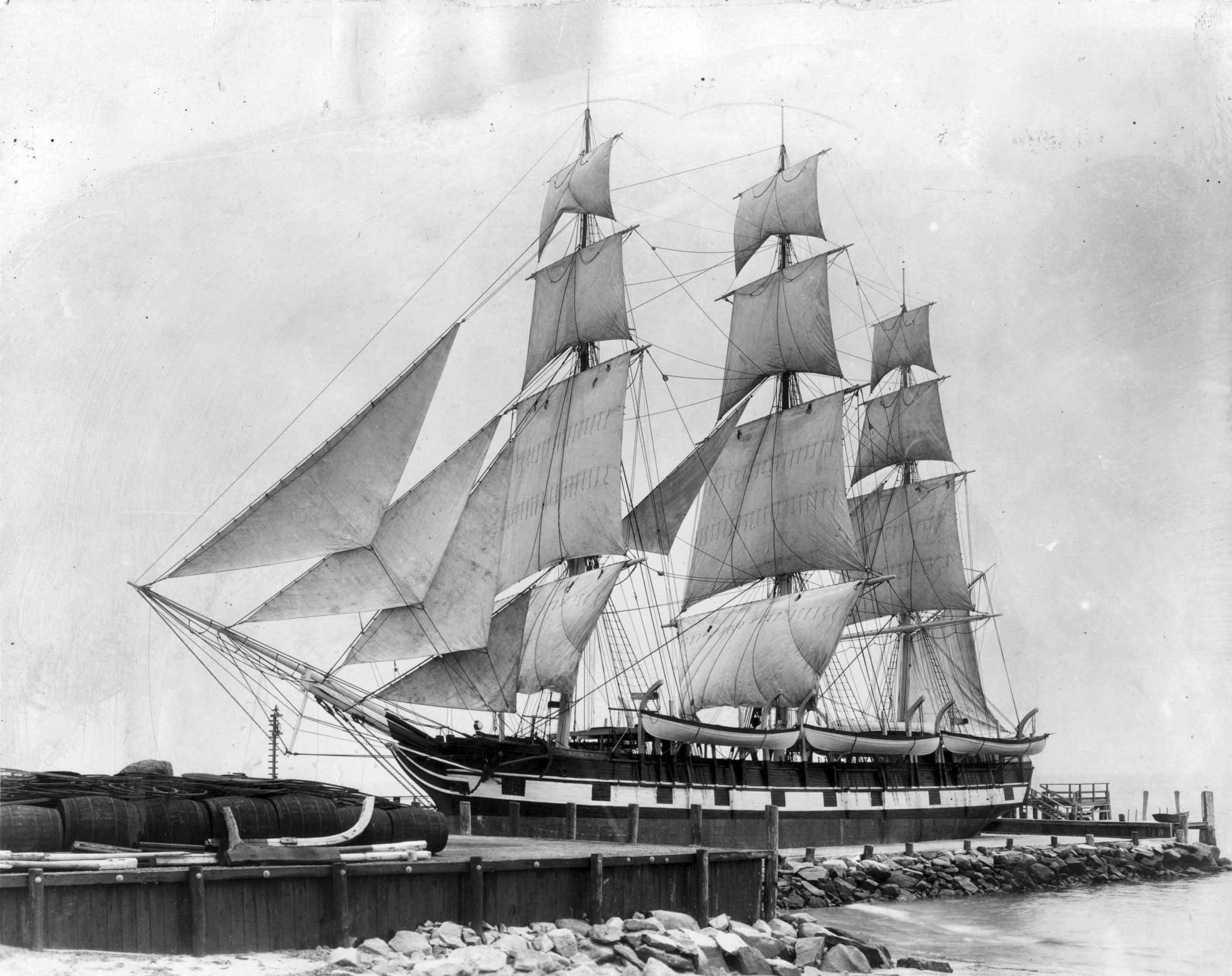 Sailing ship docked at port