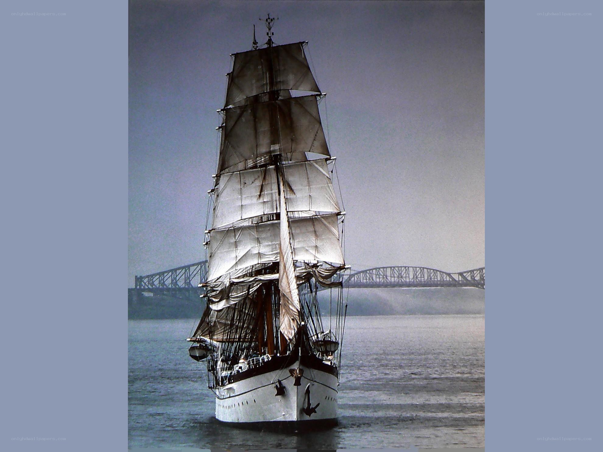 sailing ship near a bridge