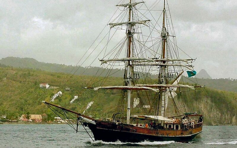 sailing ship near tropical island