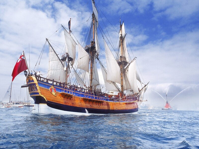 Sailing Ship on Ocean — Blue, Dramatic, Afternoon, Photograph, Flag