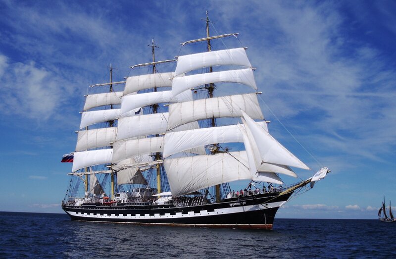 Sailing Ship on Ocean — Blue, Serene, Afternoon, Photograph, Sky, People