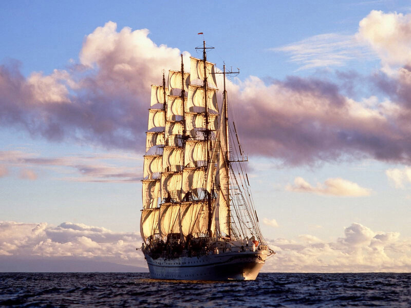 Sailing Ship on Ocean — Blue, Serene, Sunset, Photograph, Sky, Clouds
