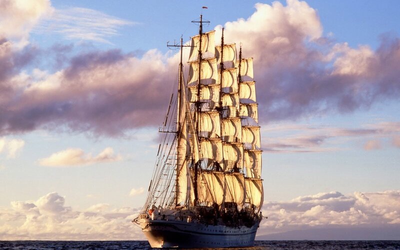 Sailing Ship on Ocean — Blue, Serene, Sunset, Photograph, Sky