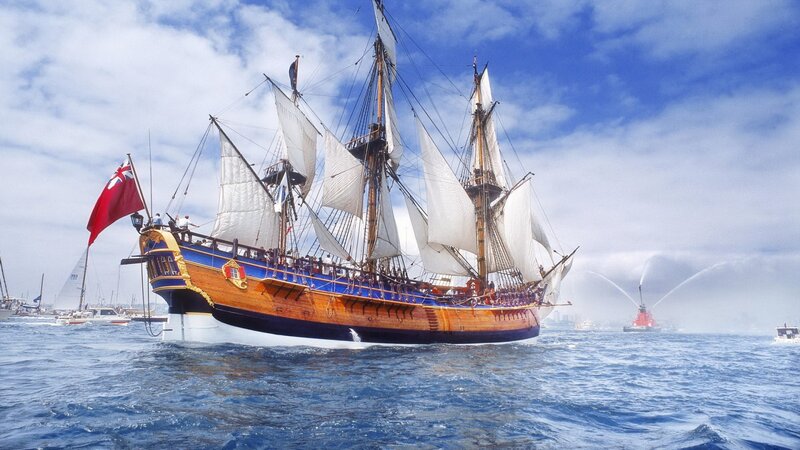Sailing Ship on Water — Blue, Dramatic, Afternoon, Photograph, Flag