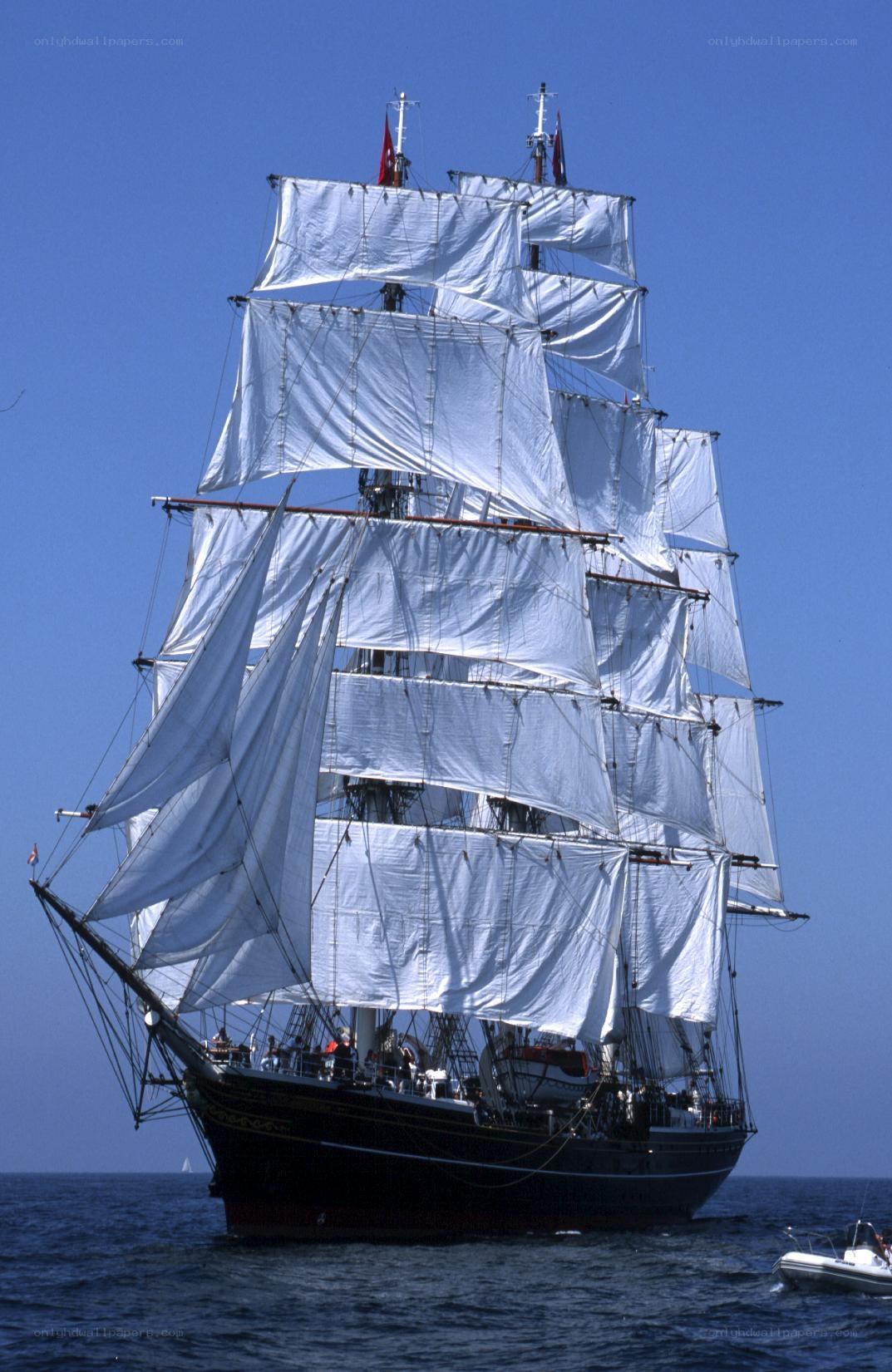 Sailing ship with full sails
