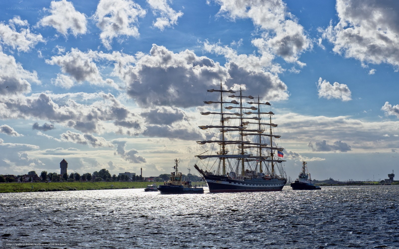 Sailing ship with tugboats