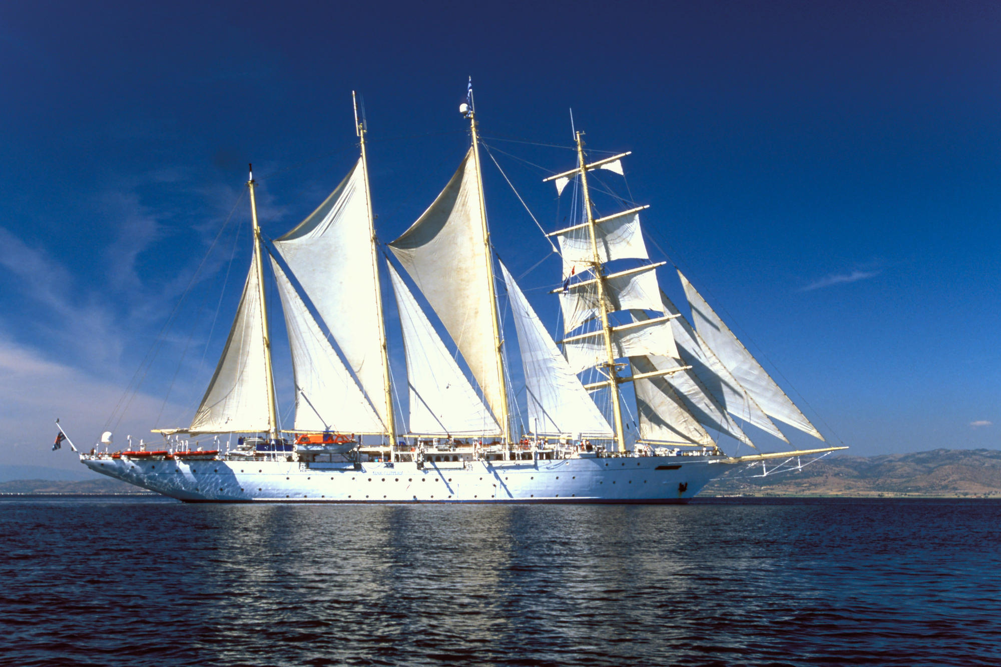Sailing ship with white sails
