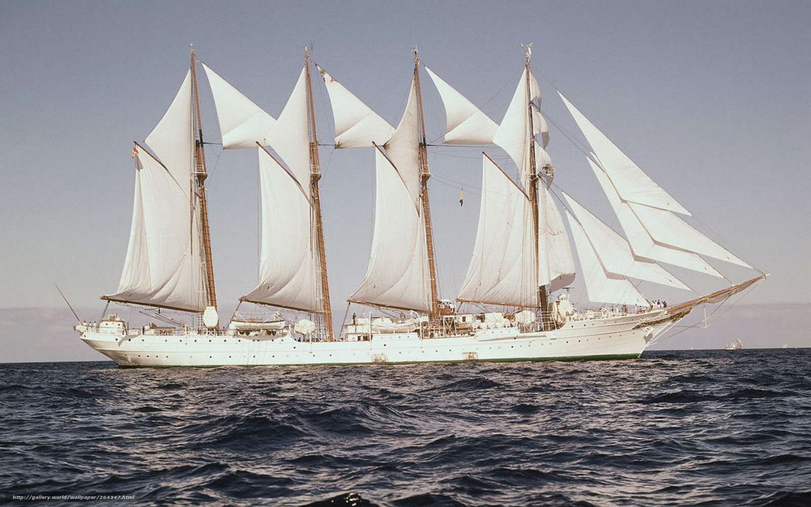Sailing ship with white sails