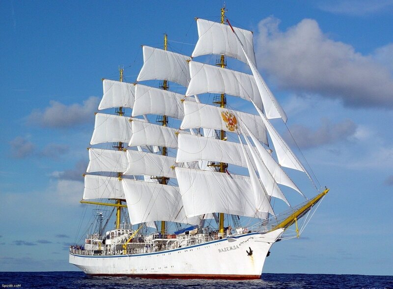 Sailing ship with white sails