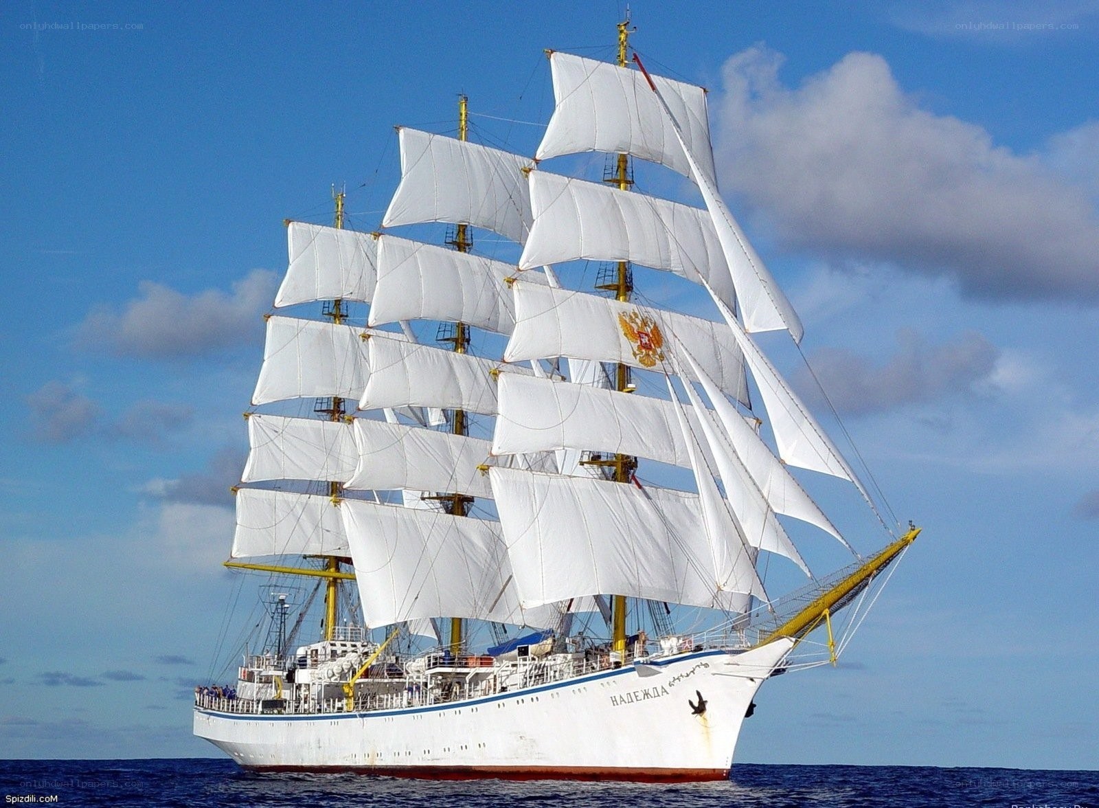 Sailing ship with white sails