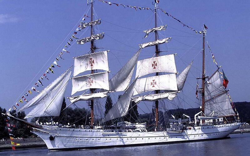 Sailing ship with white sails