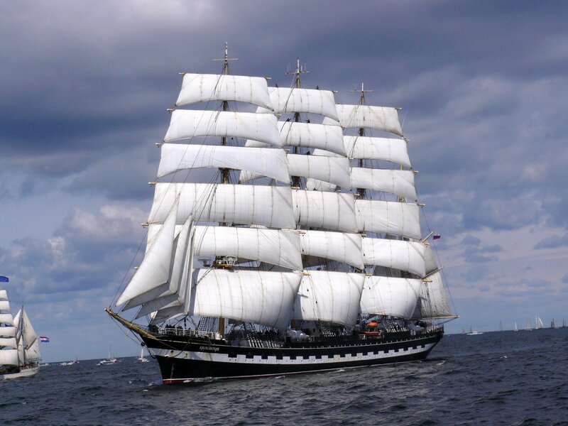 Sailing Ship with White Sails — Dramatic