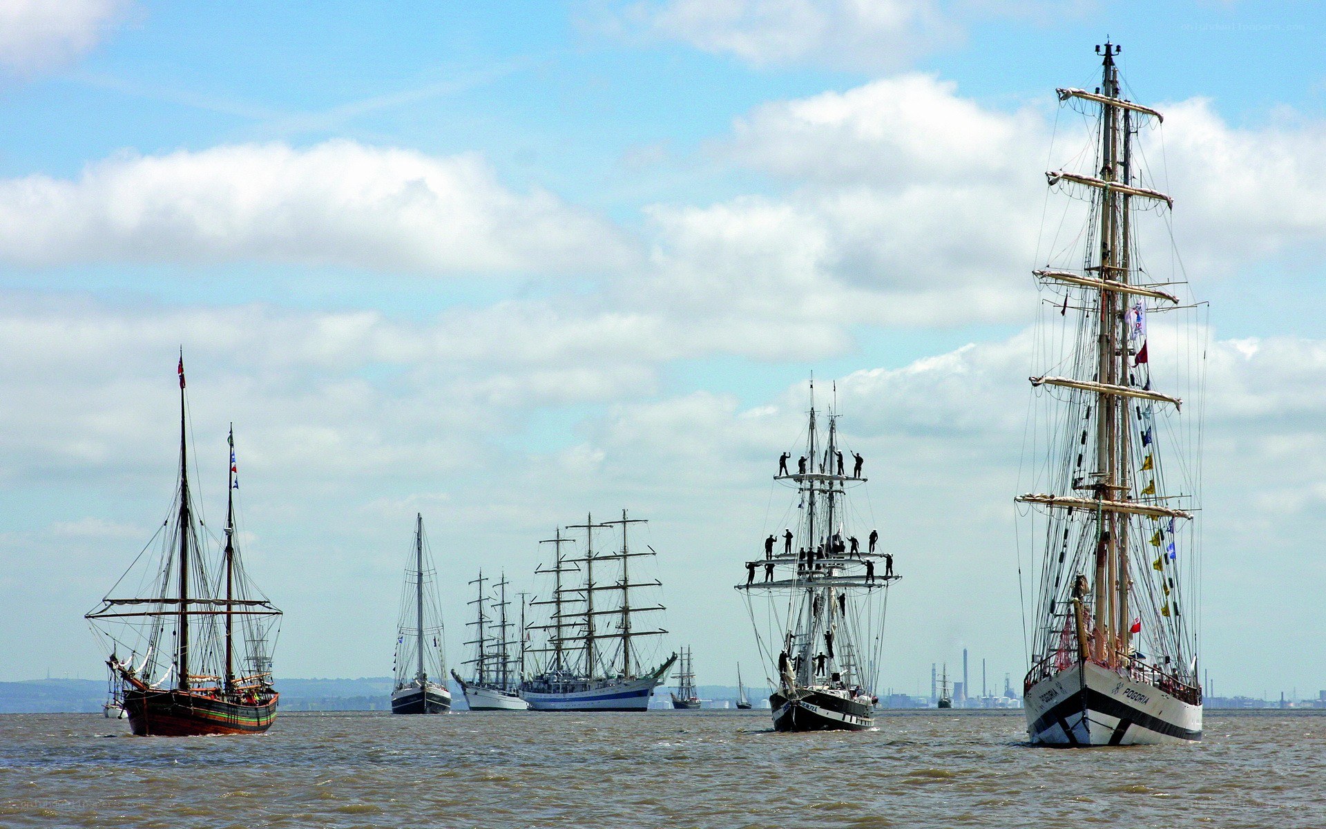 Sailing ships in a harbor