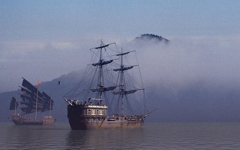 Sailing ships in misty sea