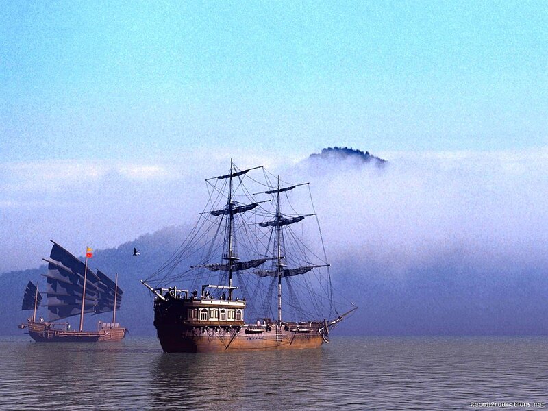 Sailing ships in misty sea