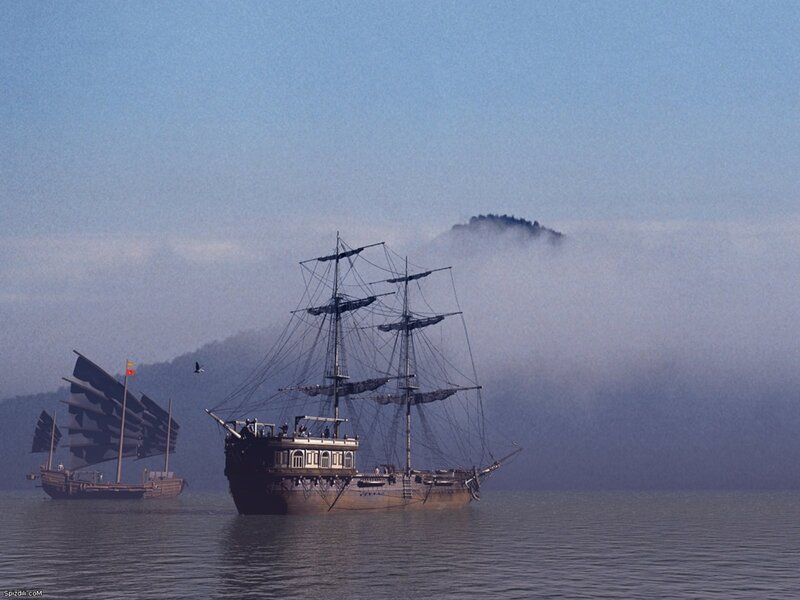 Sailing ships in misty sea