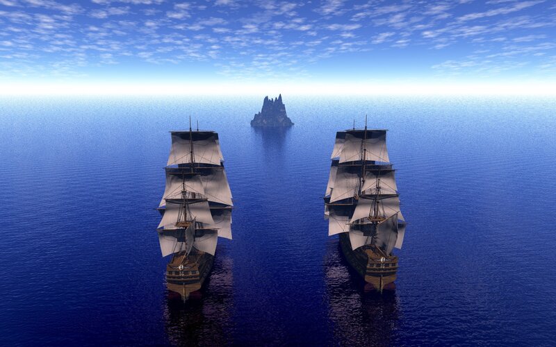 sailing ships near a rocky island