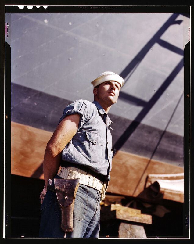 Sailor in uniform on ship deck