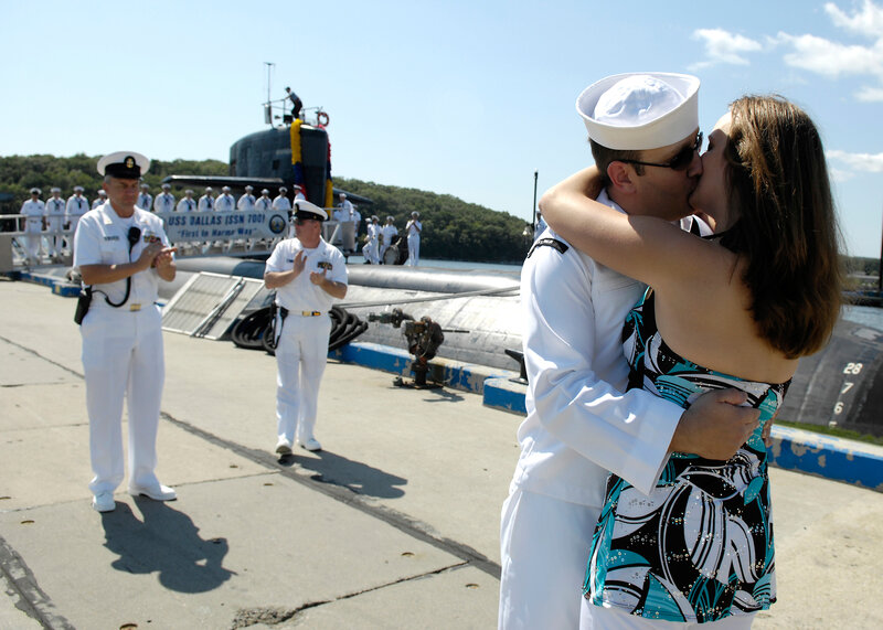 Sailor Kissing Woman