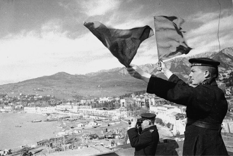 Sailor signaling with flags