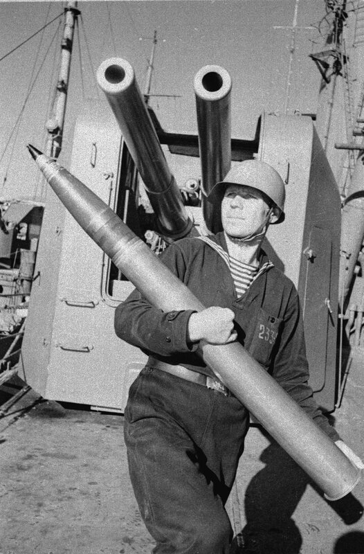 Sailor with artillery shell