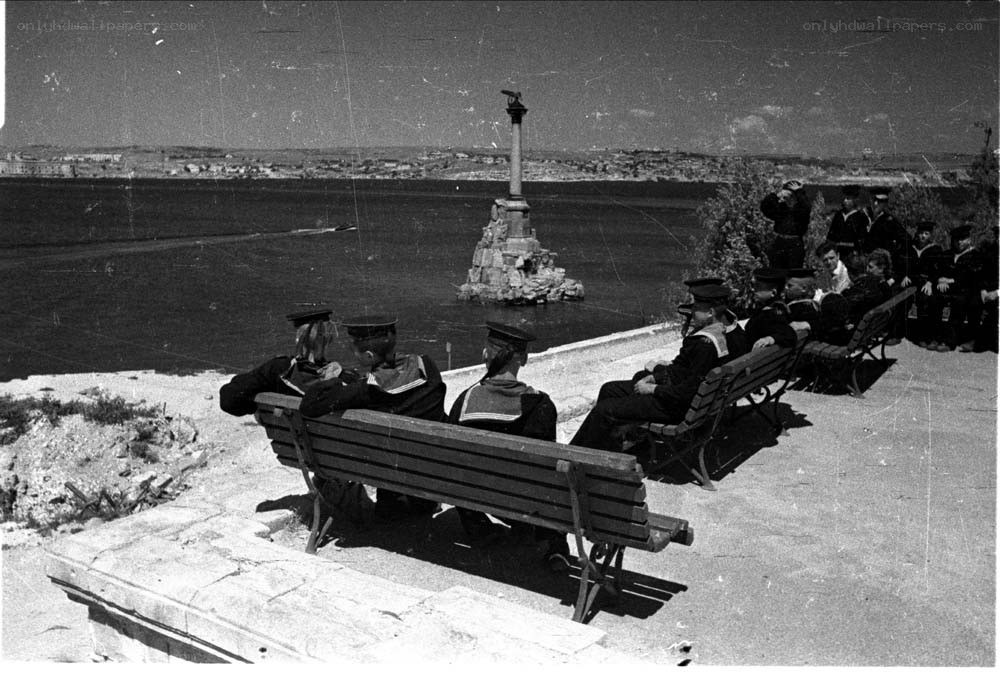 Sailors at a seaside viewpoint