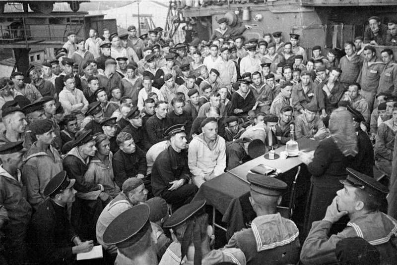 Sailors at a shipboard meeting
