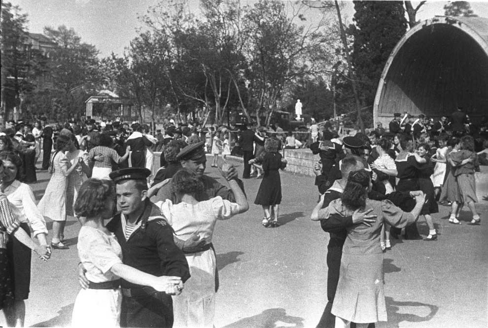 Sailors dancing in a park