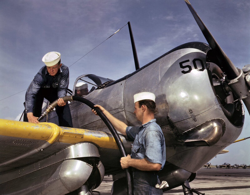 Sailors fueling a plane