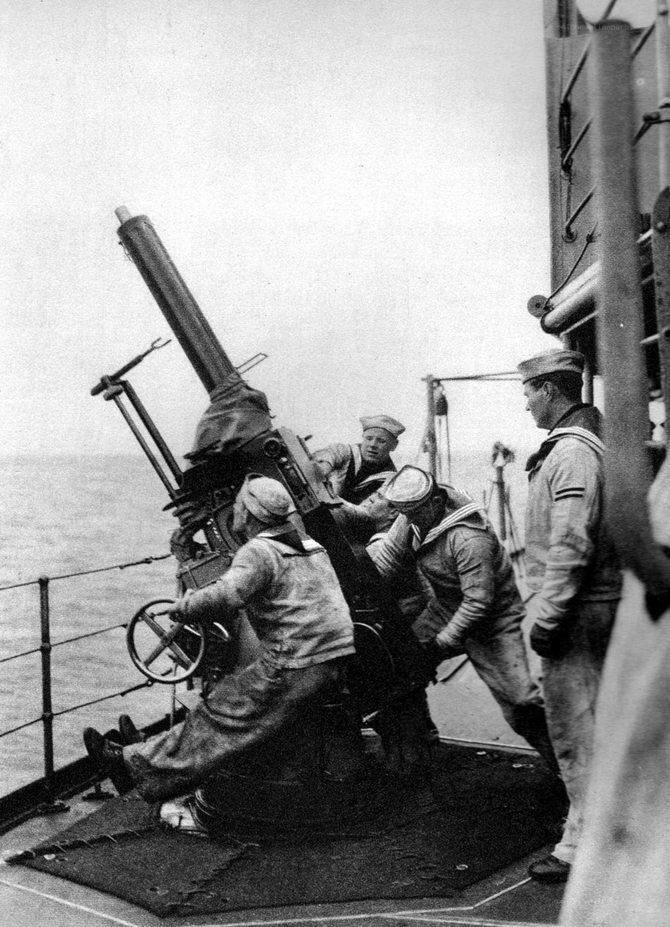 Sailors operating anti-aircraft gun