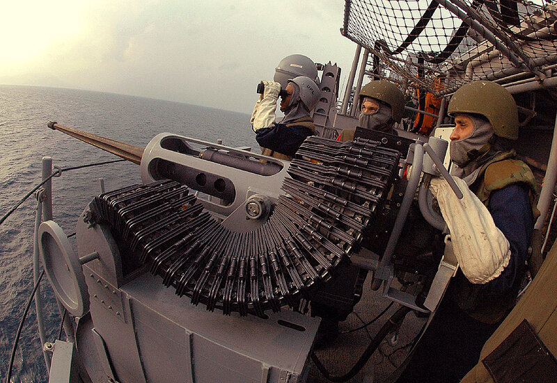 Sailors operating naval gun
