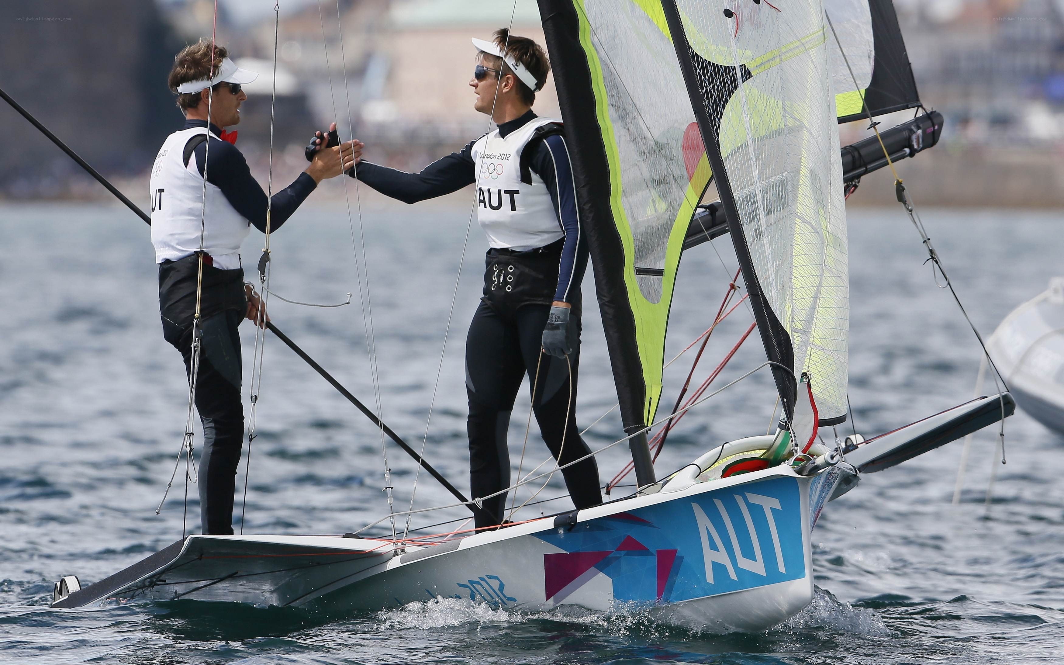 Sailors shaking hands on boat
