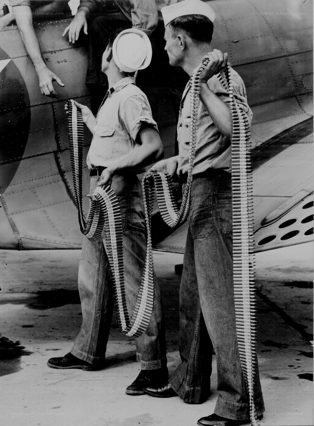Sailors with ammunition belts