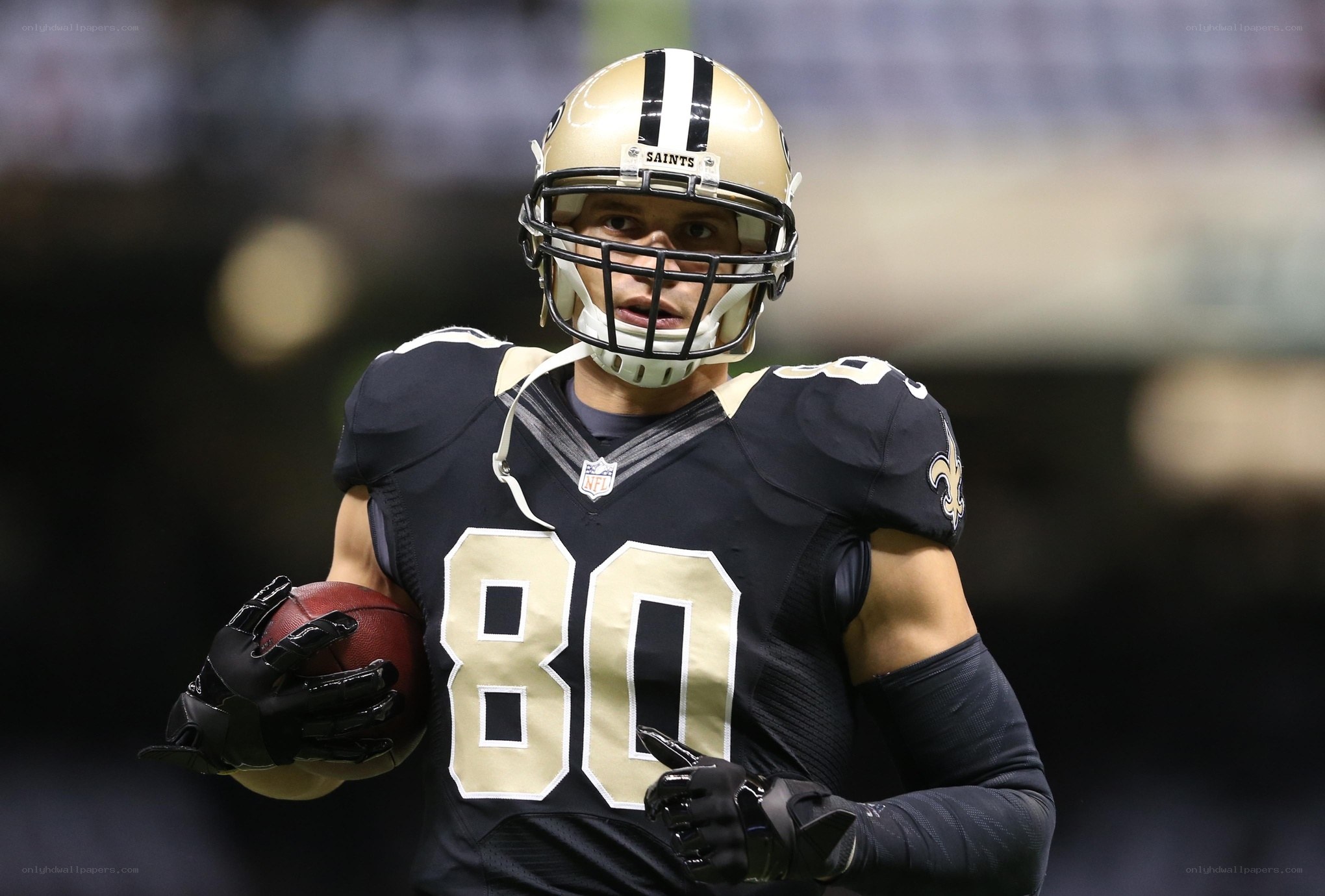 Saints player with football