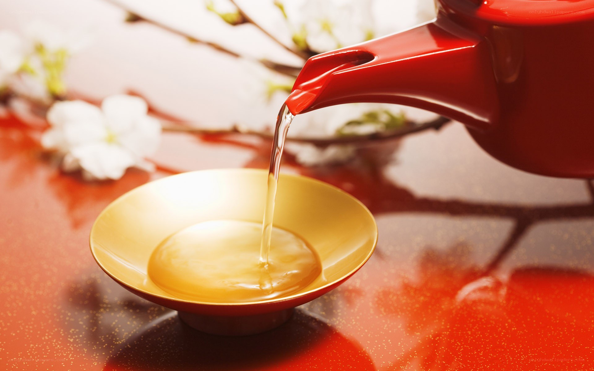 Sake being poured into a cup