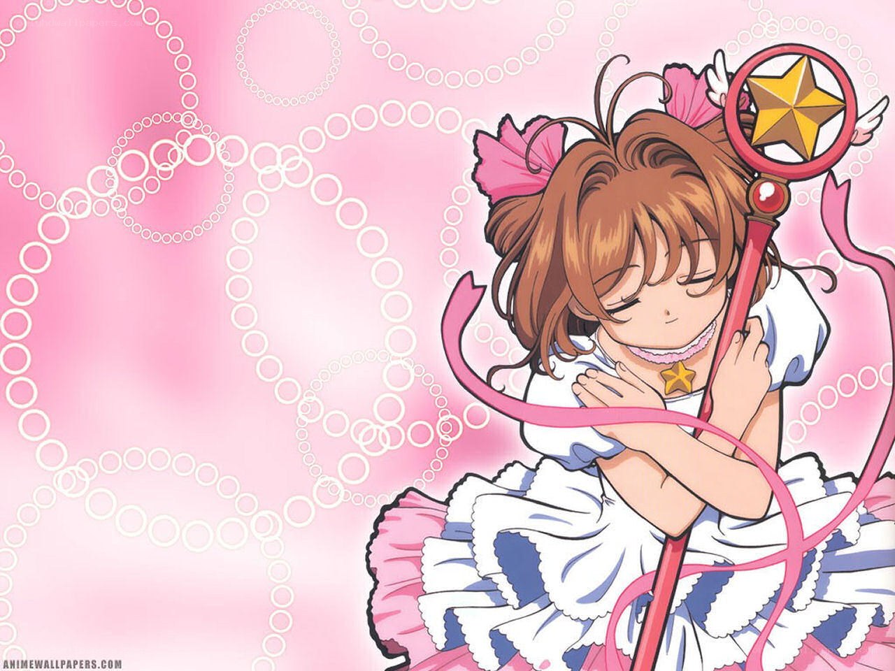 Sakura with her staff