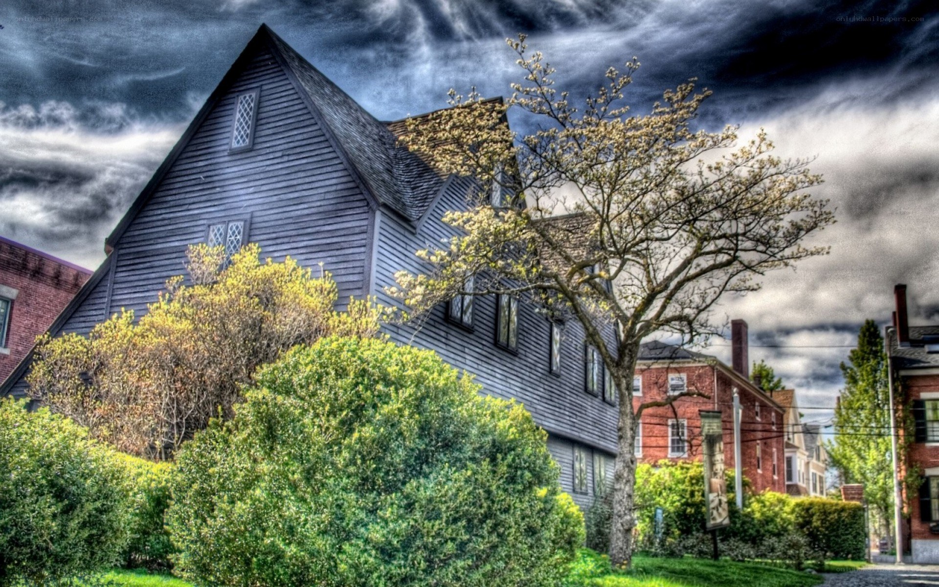 Salem witch house under stormy sky