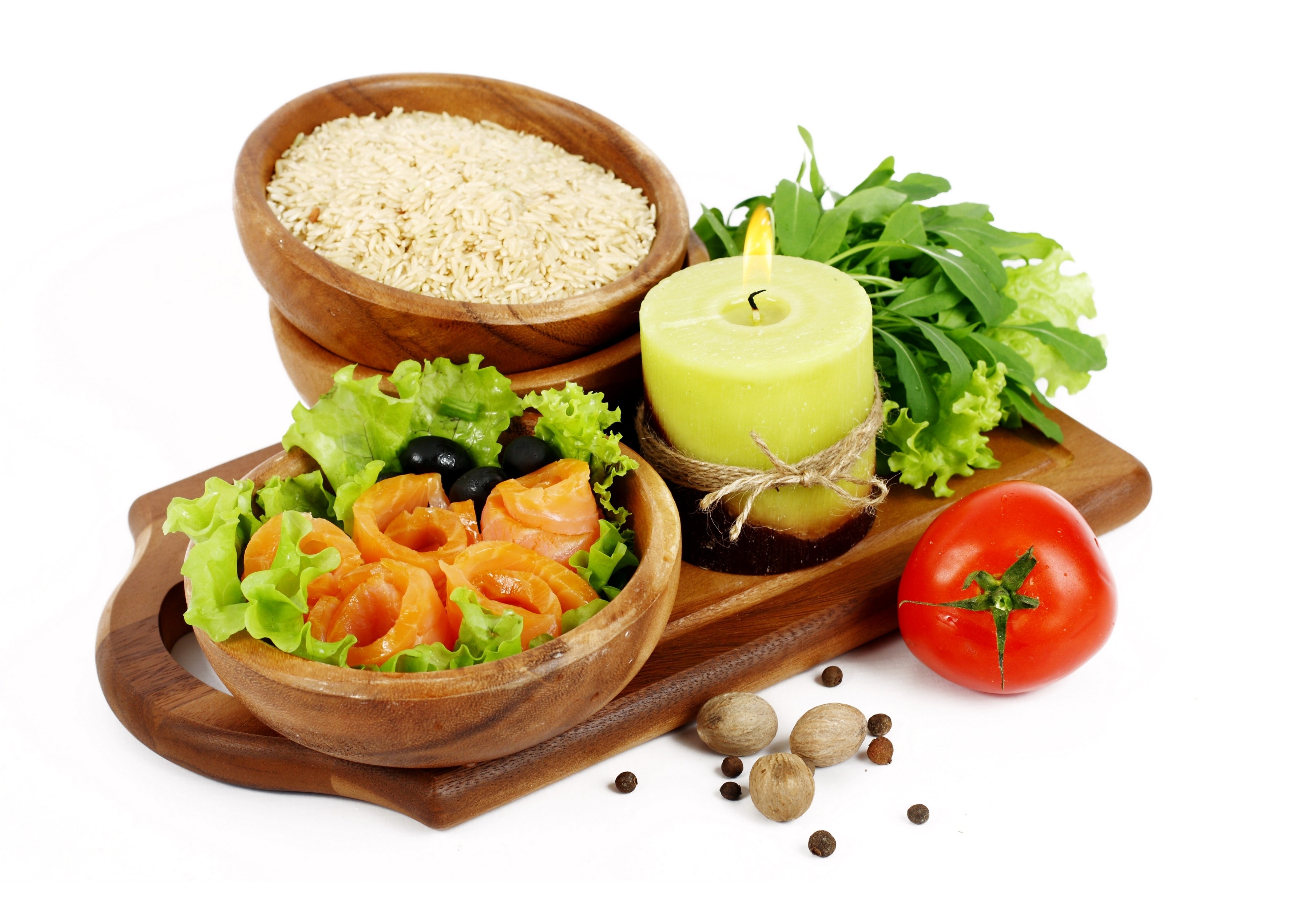 Salmon salad with rice and candle