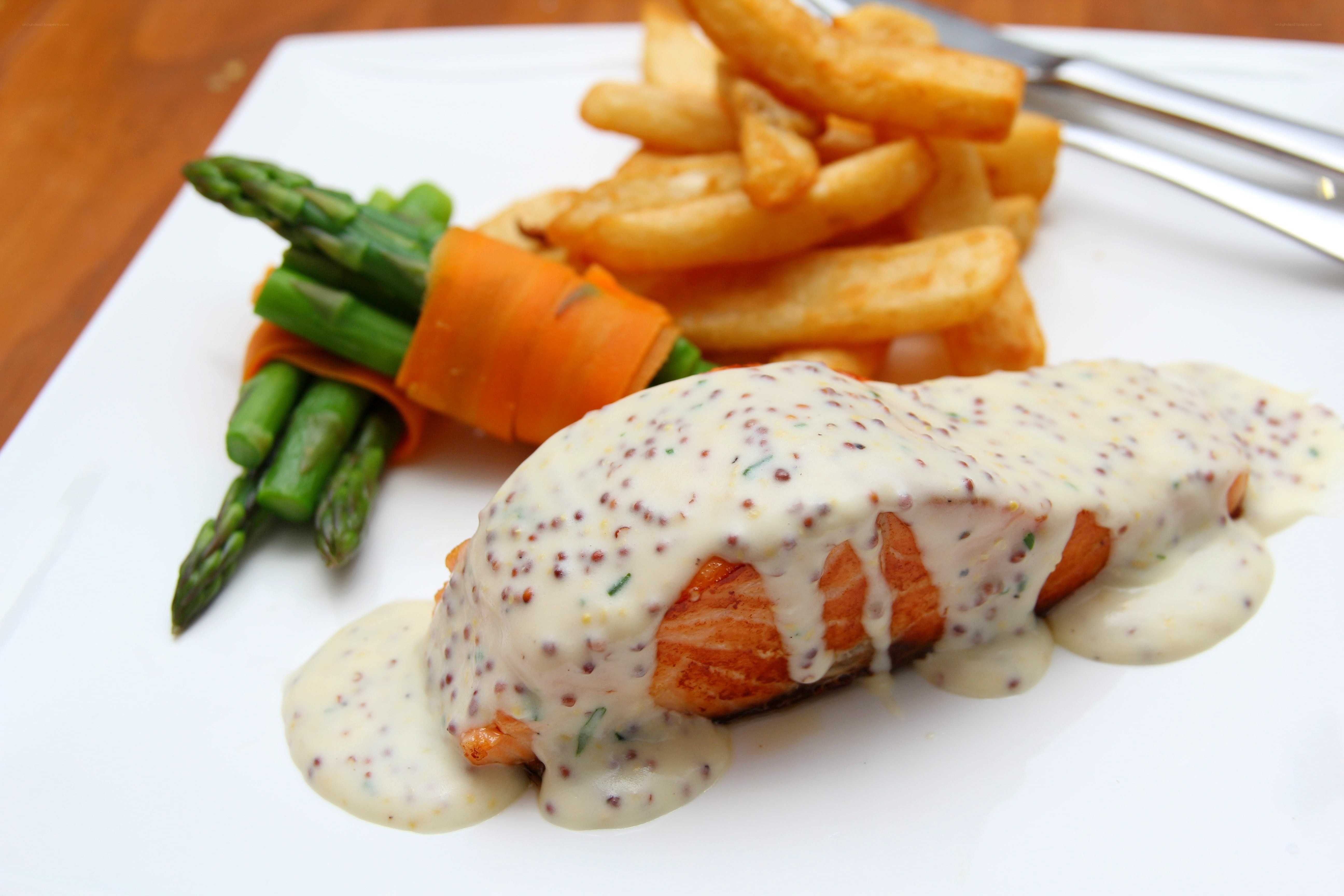 Salmon with sauce and fries