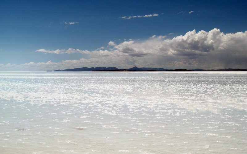 Salt flat under blue sky