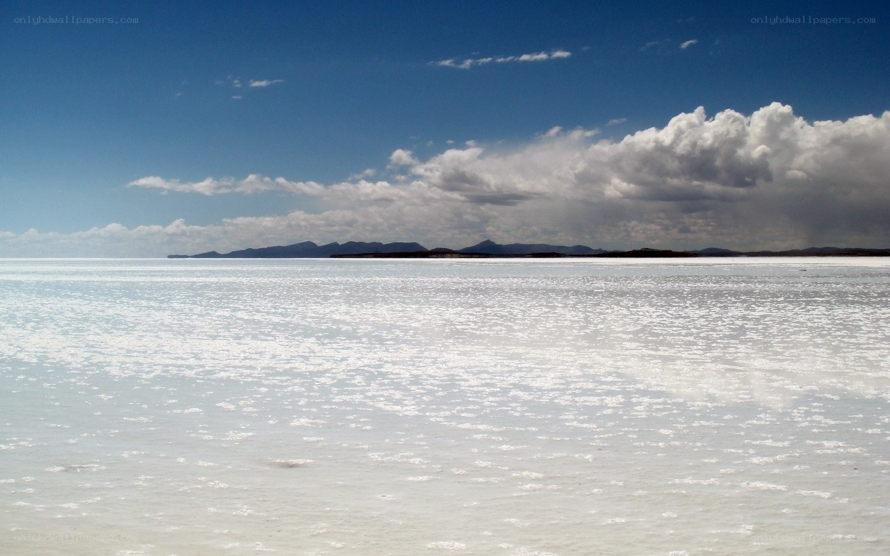 Salt flat under blue sky