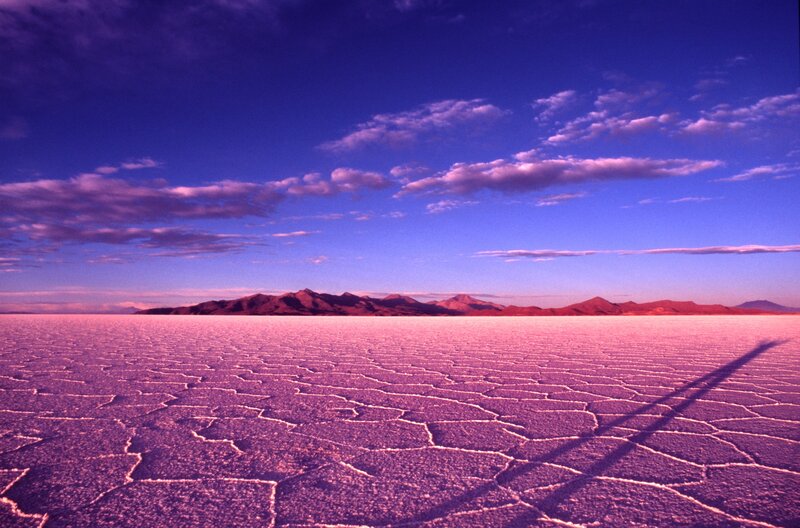 Salt flat under purple sky