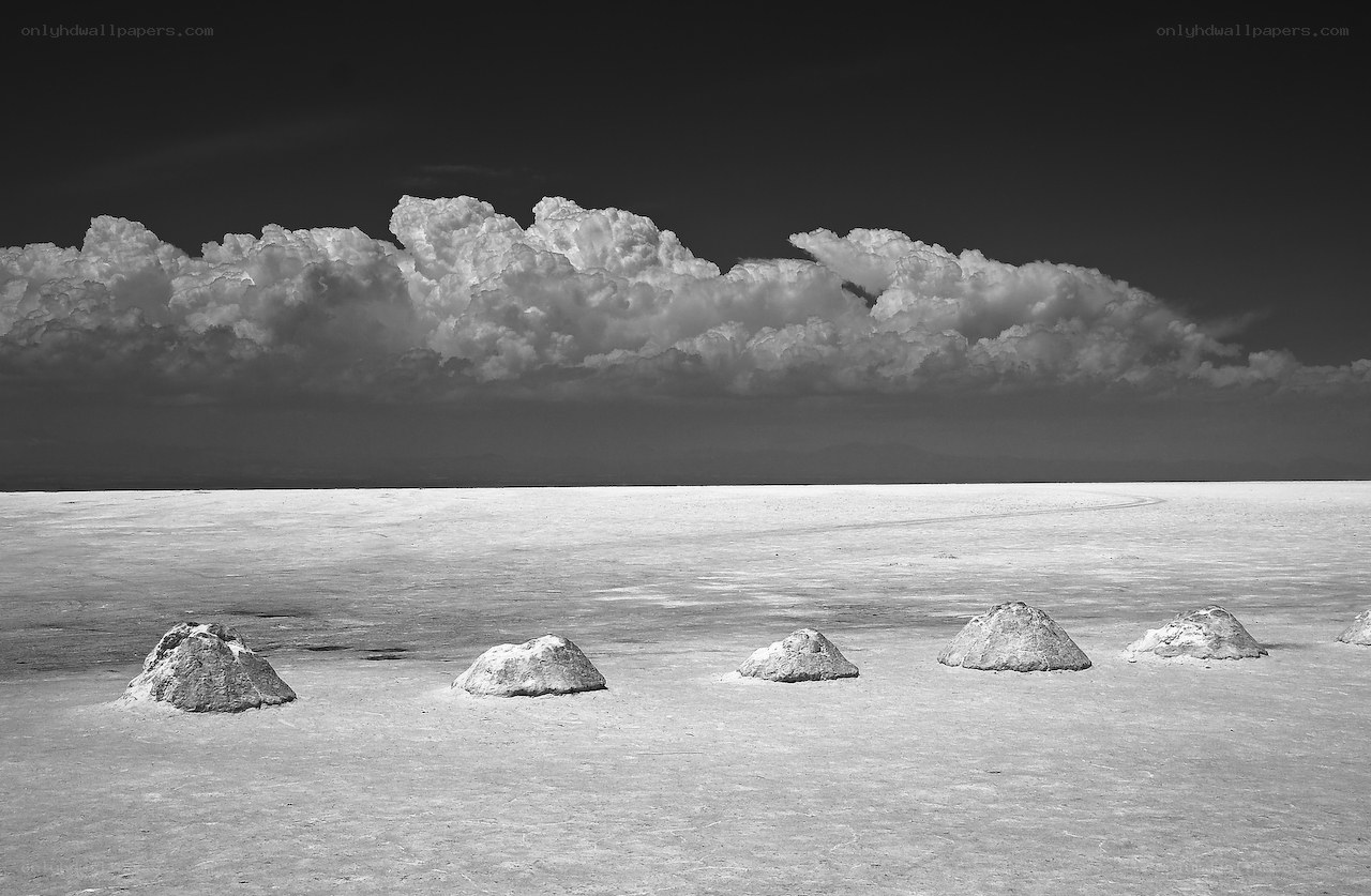 Salt flats under storm clouds