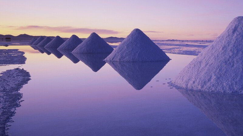 Salt piles at sunset