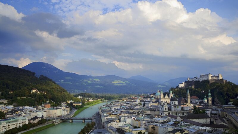 Salzburg cityscape with river and mountains
