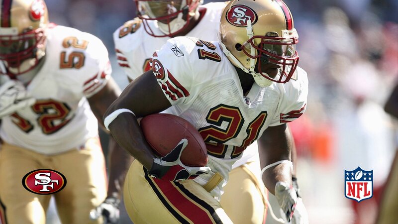 San Francisco 49ers player running with ball