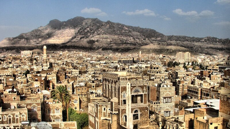 Sana'a cityscape with mountains