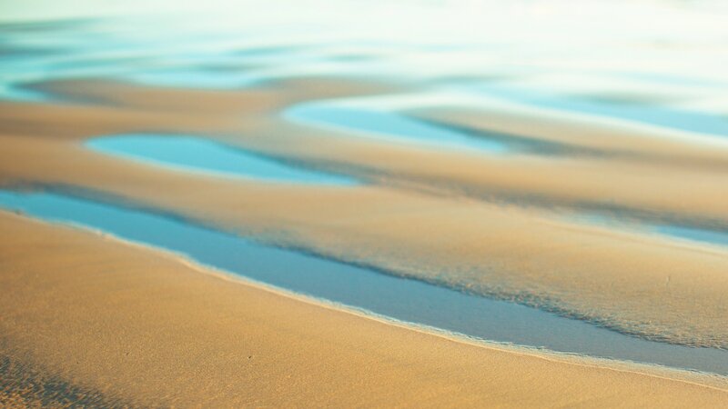 sand and water patterns on beach