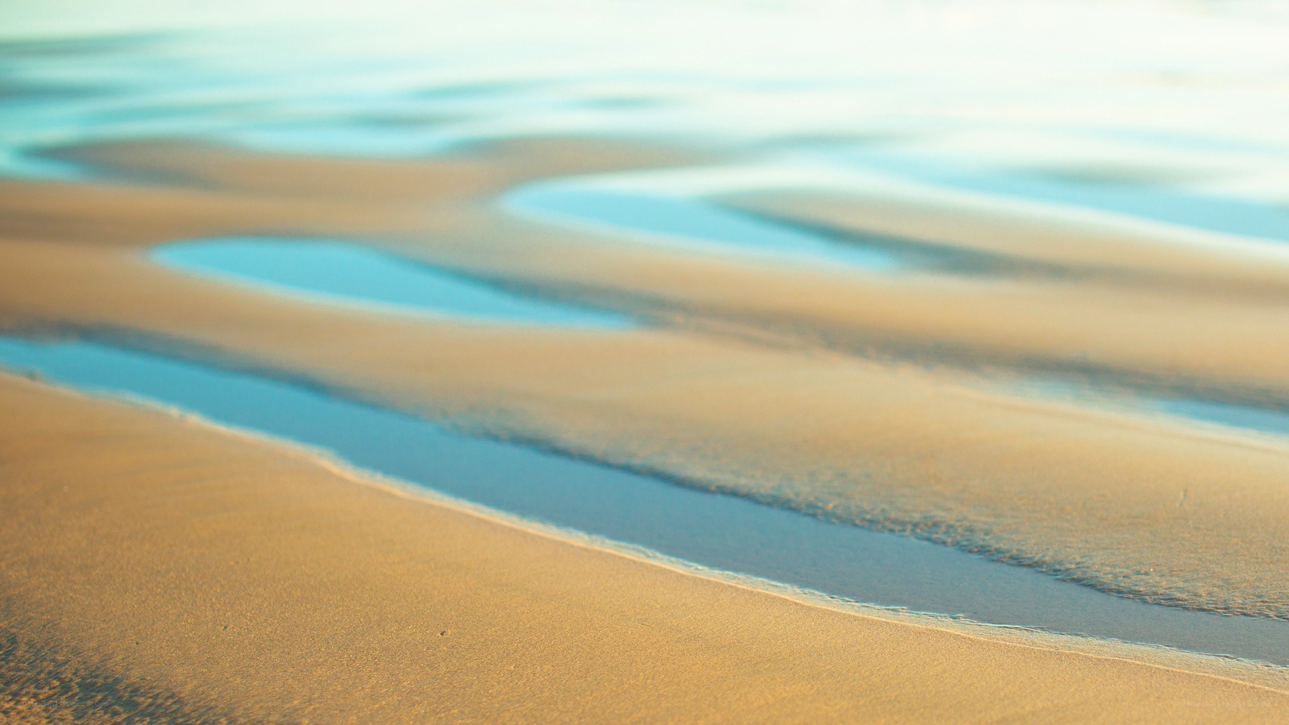 sand and water patterns on beach